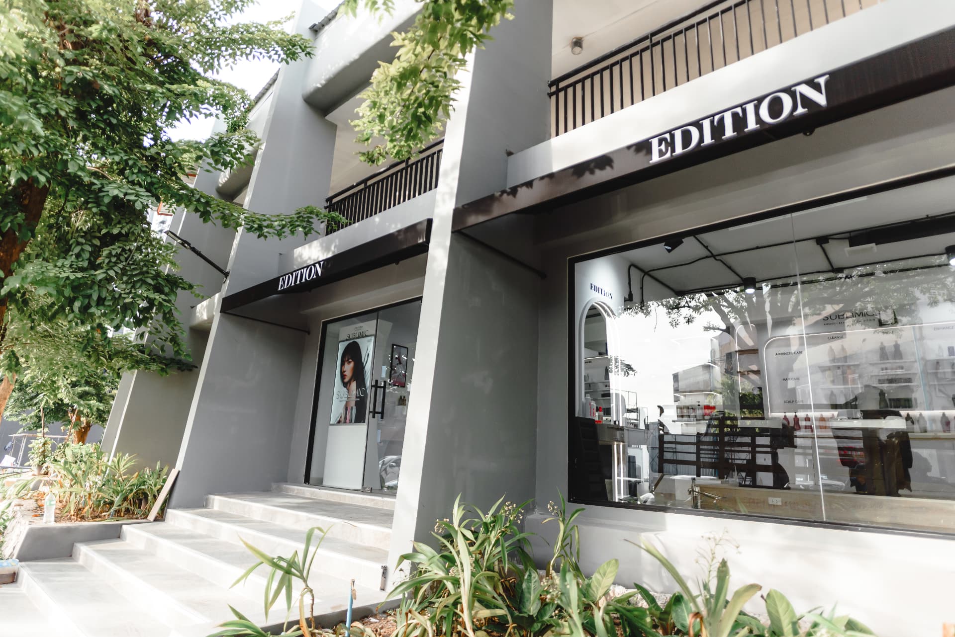 EDITION Salon exterior with EDITION awnings, front steps and large shop windows